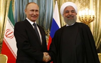 Russian President Vladimir Putin (L) shakes hands with his Iranian counterpart Hassan Rouhani during their meeting at the Kremlin in Moscow on March 28, 2017. (Sergei Karpukhin/AFP)