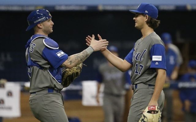 Israel pitcher Dean Kremer, right, celebrates his team's victory with catcher Nick Rickles against Taiwan after the first round game of the World Baseball Classic at Gocheok Sky Dome in Seoul, South Korea, Tuesday, March 7, 2017. (AP/Ahn Young-joon)