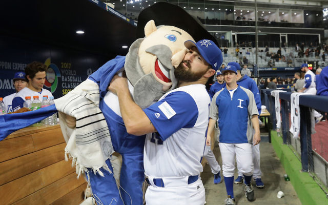 Illustrative: Infielder Cody Decker #14 of Israel holds team mascot 'The Mensch on a  Bench' after the World Baseball Classic Pool A Game Five between the Netherlands and Israel at Gocheok Sky Dome on March 9, 2017 in Seoul, South Korea. (Chung Sung-Jun/Getty Images via JTA)
