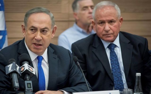 Prime Minister Benjamin Netanyahu (L) and Likud MK Avi Dichter (R) attend a Knesset Foreign Affairs and Defense Committee meeting on March 8, 2017. (Yonatan Sindel/Flash90)