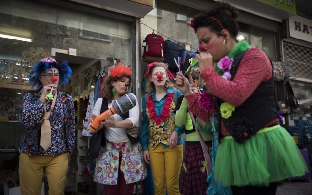 Illustrative: Israelis dress up in costumes in central Jerusalem ahead of the Jewish holiday of Purim on March 10, 2017. (Yonatan Sindel/ Flash90)