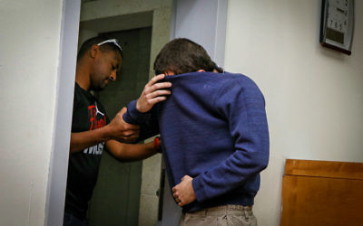 An American-Israeli Jewish teenager, accused of making dozens of anti-Semitic bomb threats in the United States and elsewhere, in a courtroom in Rishon Lezion on March 23, 2017. (Flash90)