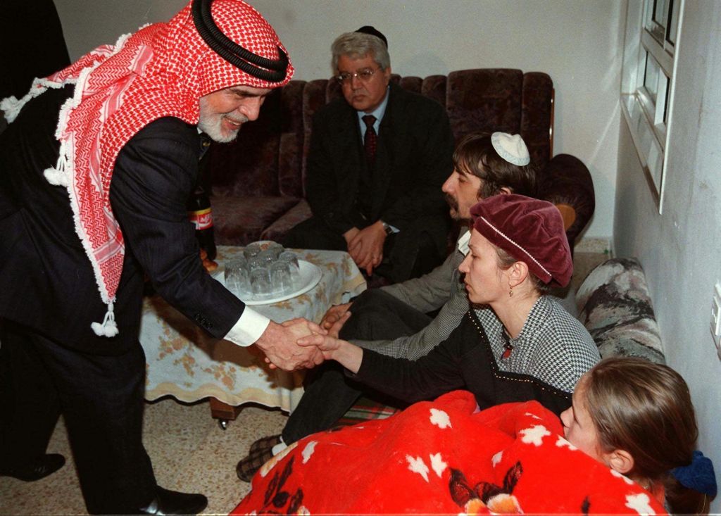 In this Sunday, March 16, 1997 file photo, King Hussein of Jordan shakes the hand of members of the Badayev family in Beit Shemesh who were in mourning after their daughter Shiri was killed by a Jordanian soldier. King Hussein came to Israel to offer condolences to the seven families who lost their daughters in an attack on a class trip. The Jordanian soldier who killed seven Israeli schoolgirls in a 1997 shooting rampage was released Sunday, March 12, 2017, after serving 20 years in prison. (AP PHOTO/GPO/HO, File)