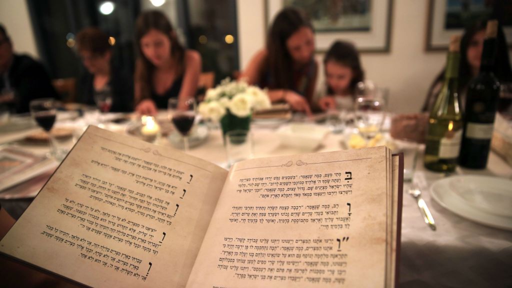 Illustrative photo of an Israeli family seen during the Passover seder meal on the first night of the eight-day long Jewish holiday, in Tzur Hadassah on April 22, 2016. (Nati Shohat/Flash 90)