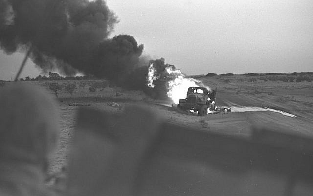 An Egyptian transport burning after a direct hit from an Israeli tank during the Six Day War, June 5, 1967. (David Rubinger/Government Press Office)