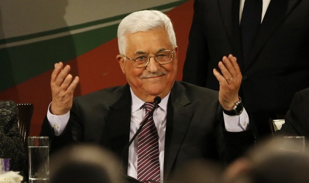 Palestinian Authority President Mahmoud Abbas gestures after delivering a speech on the second day of the 7th Fatah Congress in the West Bank city of Ramallah on November 30, 2016. (AFP/Abbas Momani)