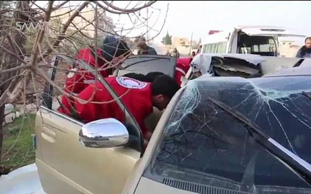 First aid workers inspecting a car damaged by a reported US airstrike on February 26, 2017. which killed Al Qaeda deputy leader Abu al-Khayr al-Masri (Screen capture: Twitter)