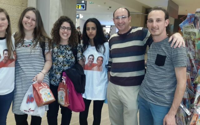 Ofir Shaer (second from right) with volunteers and Israeli travelers at Ben Gurion Airport, March 2017. (Courtesy)