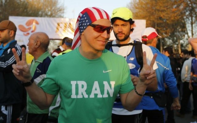 An Iranian American arrives for first international Tehran marathon at Azadi Square in Tehran on April 7, 2017. (AFP PHOTO / ATTA KENARE)