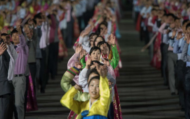 Participants perform in a mass dance event on Kim Il-Sung square marking the 105th anniversary of the birth of late North Korean leader Kim Il-Sung, in Pyongyang on April 15, 2017. (Ed Jones/AFP)