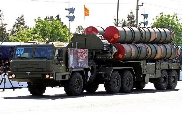An Iranian military truck carries parts of the S-300 air defense missile system during a parade on the occasion of the country's Army Day, on April 18, 2017, in Tehran. (AFP Photo/Atta Kenare)