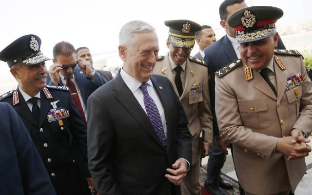 Egypt's Minister of Defense Sedki Sobhi (R) greets US Defense Secretary James Mattis (C) upon his arrival at Cairo International Airport in Cairo on April 20, 2017. (AFP PHOTO / POOL / JONATHAN ERNST)