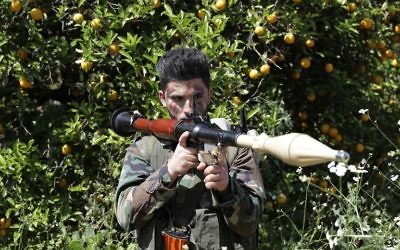 A fighter from the Hezbollah terror group is seen standing with a RPG near the town of Naqura on the Lebanese-Israeli border on April 20, 2017. (AFP Photo/Joseph Eid)