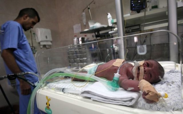 A newborn is seen inside an incubator at the neonatal intensive care unit at the Al-Shifa hospital in Gaza City on April 23, 2017. (Said Khatib/AFP)