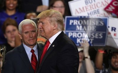 US President Donald Trump (R) is introduced by Vice President Mike Pence (L) during a "Make America Great Again Rally" at the Pennsylvania Farm Show Complex Expo Cent,er April 29, 2017, in Harrisburg, Pennsylvania. (Alex Wong/Getty Images/AFP)