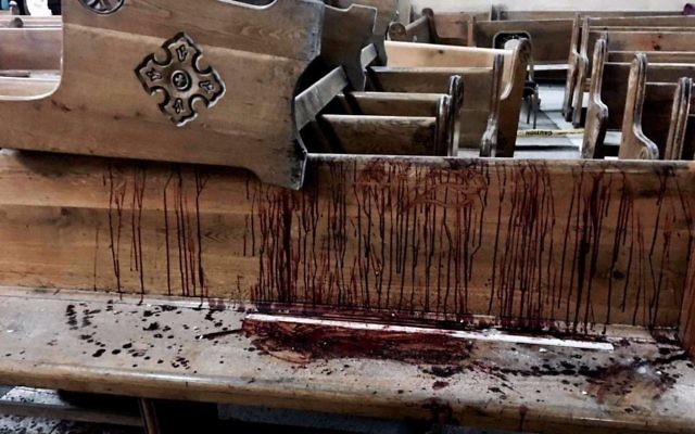 Blood stains pews inside the St. George Church after a suicide bombing in the Nile Delta town of Tanta, Egypt, Sunday, April 9, 2017. (AP Photo/Nariman El-Mofty)