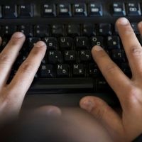 Illustrative: A man typing on a computer keyboard, January 24, 2017. (Flash90)
