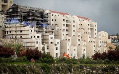 Construction in the Israeli settlement of Kiryat Arba, near the West Bank city of Hebron, on April 2, 2017. (Wisam Hashlamoun/Flash90)