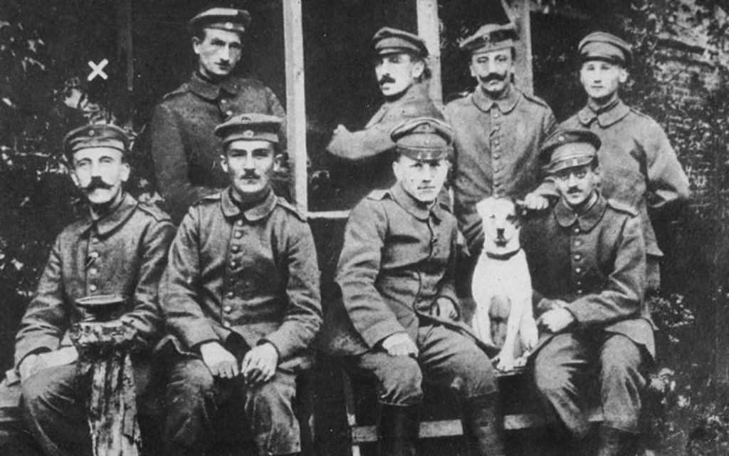 Adolf Hitler (seated, far left) posed with fellow soldiers during their World War I service for Germany (Public domain)