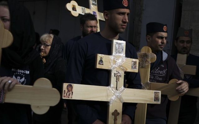 Serbian Christian pilgrims attend Good Friday procession in Jerusalem Friday, April 14, 2017. Good Friday is a Christian holiday which marks the crucifixion of Jesus Christ and his death. (Dan Balilty/AP)