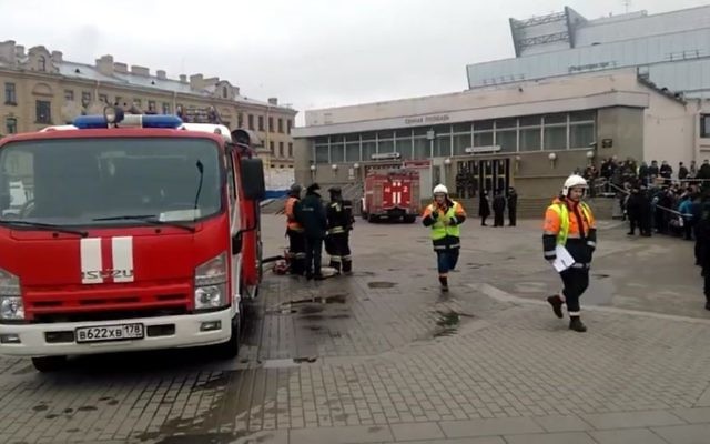 In this image taken from video footage, emergency services work outside Sennaya Square metro station in St Petersburg, Russia, Monday, April 3, 2017. (AP Photo)