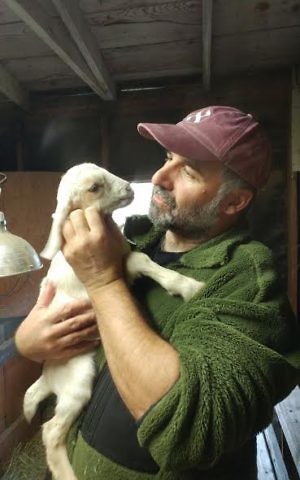 Rabbi Marc Soloway holding a baby goat born earlier this month. (Courtesy)