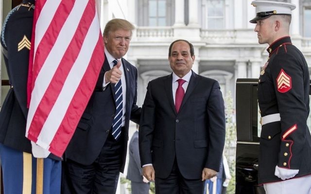 President Donald Trump gives a thumbs up to members of the media as he greets Egyptian President Abdel Fattah el-Sissi at the White House on April 3, 2017. (AP Photo/Andrew Harnik)