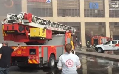 Illustrative: Paramedics and firefighters at the scene of a fire that broke out at the Glilot Cinema City on April 11, 2017.  (screen capture: YouTube)
