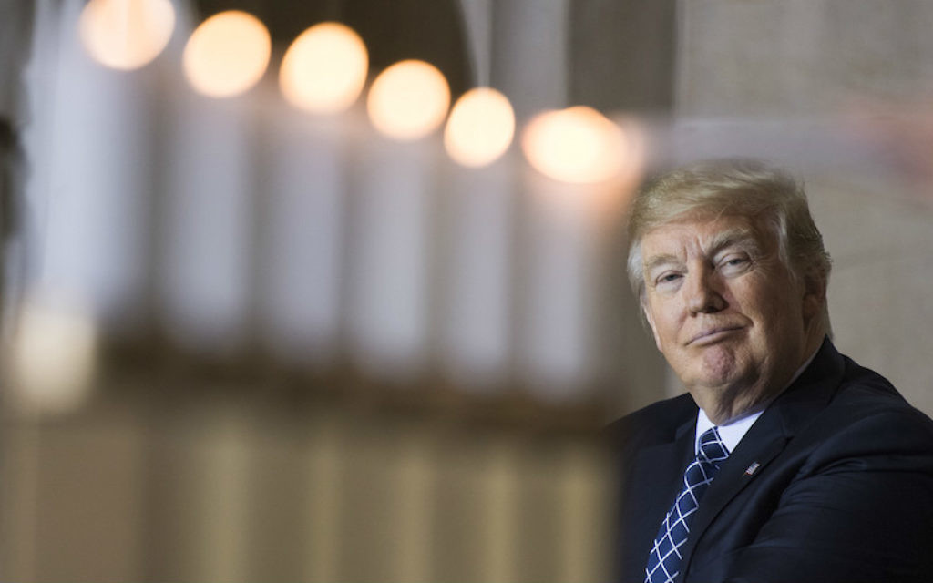 US President Donald Trump watching the lighting of memorial candles during the annual Holocaust Day of Remembrance ceremony in the Capitol Rotunda, April 25, 2017. (Tom Williams/CQ Roll Call/Getty Images via JTA)