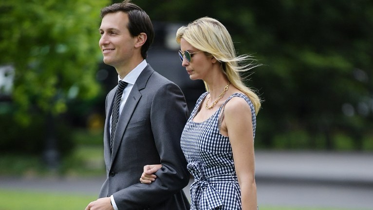 Jared Kushner and Ivanka Trump make their way across the South Lawn to board Marine One at the White House in Washington, DC on May 4, 2017. (AFP Photo/Mandel Ngan)