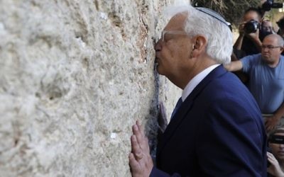 New US ambassador to Israel David Friedman kisses the Western Wall in the Old City of Jerusalem on May 15, 2017. (AFP Photo/Menahem Kahana)