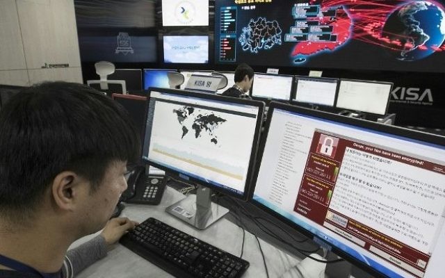 Illustrative: Staff monitoring the spread of ransomware cyberattacks at the Korea Internet and Security Agency (KISA) in Seoul, May 15, 2017. (AFP/ YONHAP)