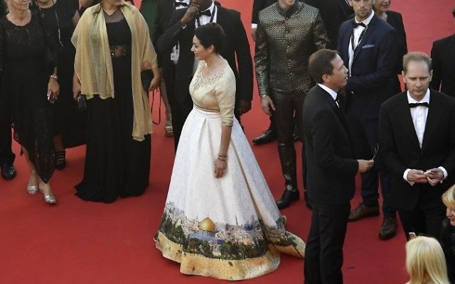 Culture Minister Miri Regev wearing a dress featuring the old city of Jerusalem in Cannes on May 17, 2017 (AFP Photo/Antonin Thuillier)