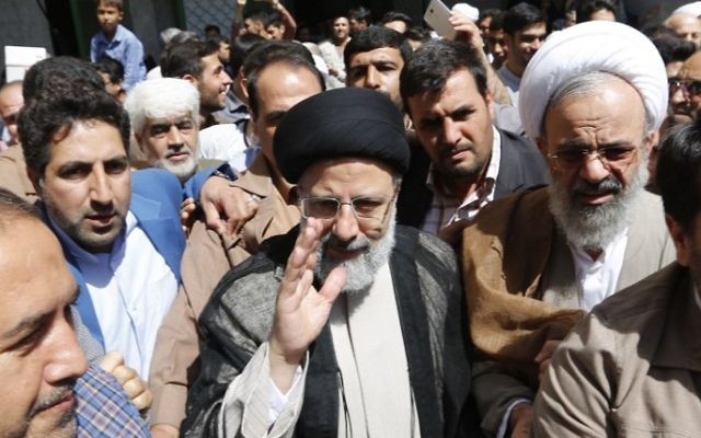Iranian defeated presidential candidate Ebrahim Raisi arrives to cast his ballot for the presidential elections at a polling station in southern Tehran on May 19, 2017. (Atta Kenare/AFP)