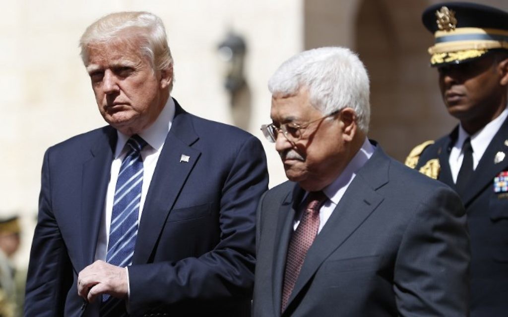 US President Donald Trump (L) is welcomed by Palestinian Authority President Mahmoud Abbas at the presidential palace in the West Bank city of Bethlehem on May 23, 2017. (Thomas Coex/AFP)