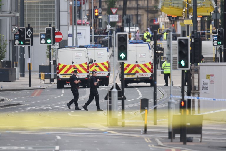 Armed police patrol near Manchester Arena following a deadly terror attack in Manchester, northwest England on May 23, 2017. (AFP/Oli SCARFF)