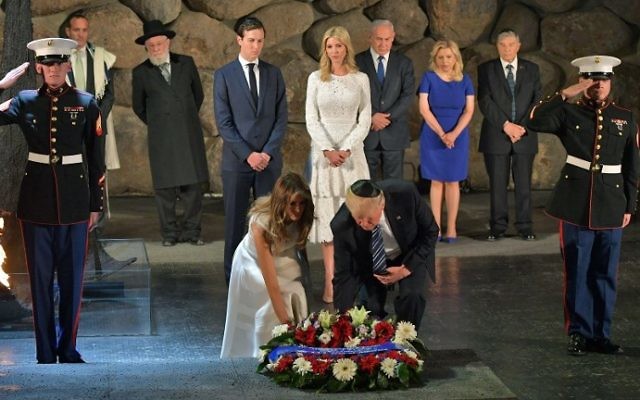 US President Donald Trump (C-R) and First Lady Melania Trump (C-L) lay a wreath during a visit to the Yad Vashem Holocaust Memorial museum on May 23, 2017, in Jerusalem. (MANDEL NGAN / AFP)