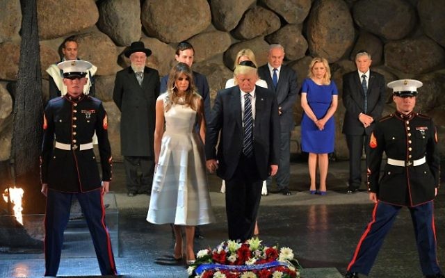 US President Donald Trump (C-R) and First Lady Melania Trump (C-L) lay a wreath during a visit to the Yad Vashem Holocaust Memorial museum, on May 23, 2017, in Jerusalem. (MANDEL NGAN / AFP)