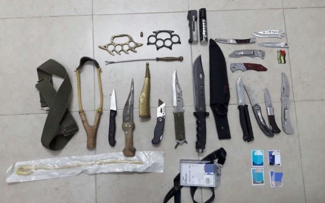 Knives and assorted weaponry found by the IDF during a raid in the West Bank city of Hebron on May 8, 2017. (IDF Spokesperson's Unit)