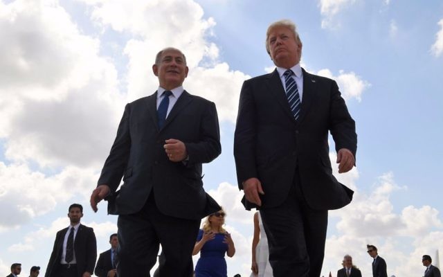 US President Donald Trump (right) and Prime Minister Benjamin Netanyahu at Ben Gurion Airport on May 23, 2017, at the end of Trump's visit to Israel (Coby Gideon / GPO)