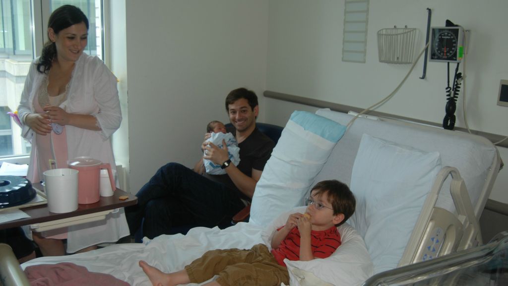 Lauren Smith Brody with her family in the hospital room after the birth of her youngest child. (Courtesy)
