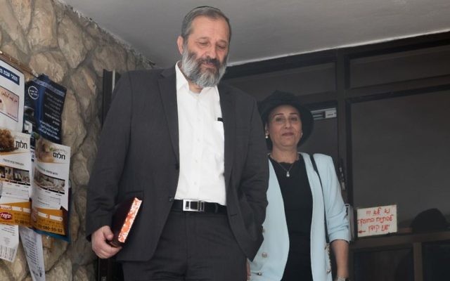 Interior Minister Aryeh Deri and his wife Yaffa, seen leaving their home in Jerusalem, May 29, 2017. (Yonatan Sindel/Flash90)