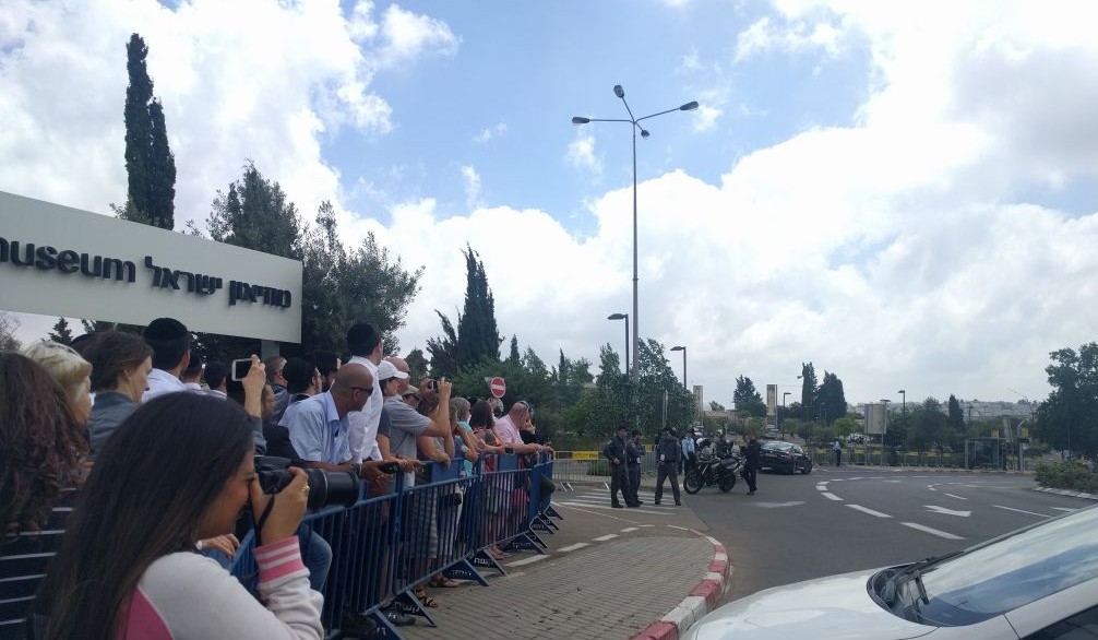 Trump supporters taking photos of the motorcade arriving at the Israel Museum on May 22, 2017. The motorcade arrived from the back entrance so did not pass the group of supporters. (Melanie Lidman/Times of Israel)