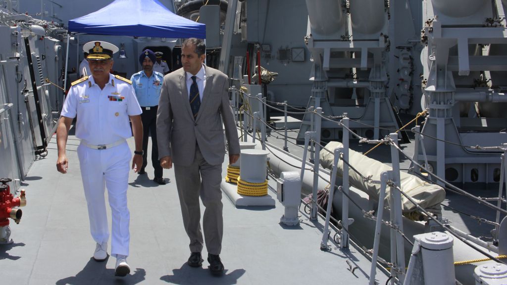 Indian Ambassador Pavan Kapoor and Rear Admiral RB Pandit walk the deck of the INS Trishul, docked in Haifa as part of an official visit by the Indian Navy on May 10, 2017. (Judah Ari Gross/Times of Israel)