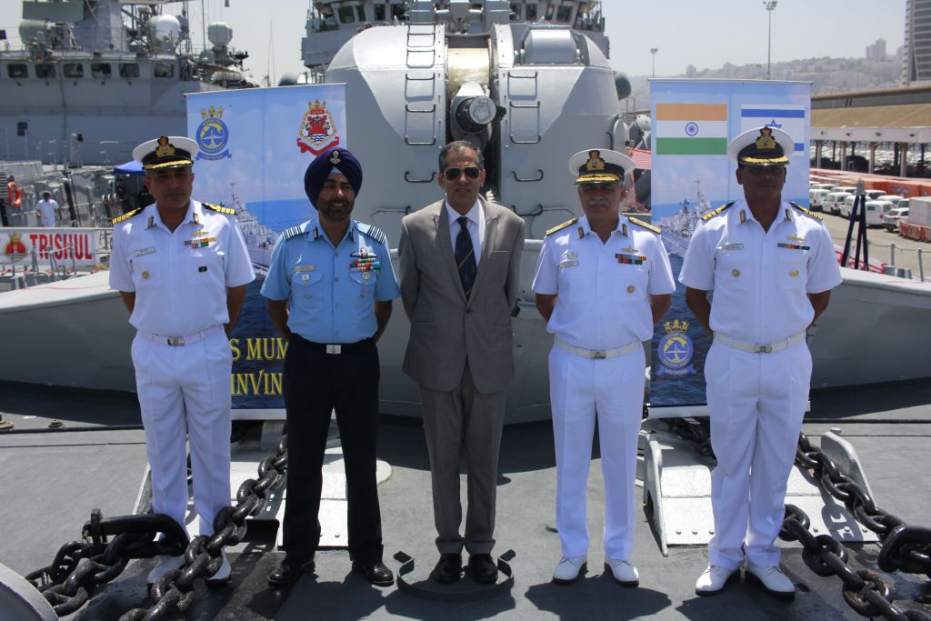 From left, Cpt. Sanjay Sachdeva, Indian defense attache Gp. Cpt. Tejpal Singh, Indian Ambassador Pavan Kapoor, Rear Admiral RB Pandit and Cpt. Sunil Kumar Roy pose for a photograph on board the INS Trishul, docked in Haifa as part of an official visit by the Indian Navy on May 10, 2017. (Judah Ari Gross/Times of Israel)