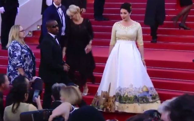 Culture Minister Miri Regev (r) wears specially designed Jerusalem dress to Cannes film festival, May 17, 2017 (Screen capture: Channel 10)
