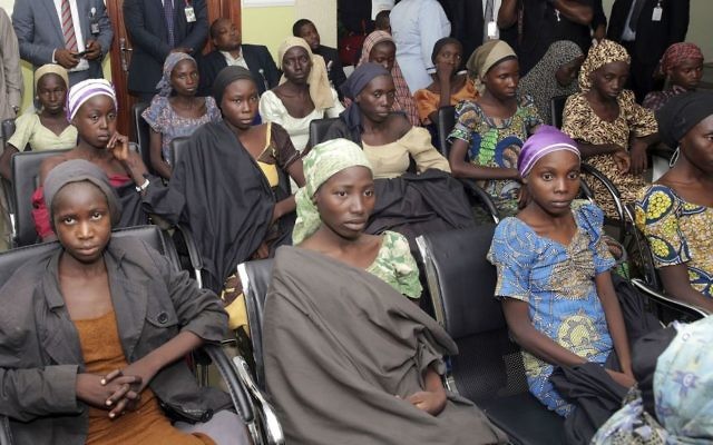File: In this Thursday, Oct. 13, 2016 file photo released by the Nigeria State House, Chibok schoolgirls recently freed from Islamic extremist captivity are seen during a meeting with Nigeria's Vice President Yemi Osinbajo in Abuja, Nigeria. (Sunday Aghaeze/Nigeria State House via AP, File)