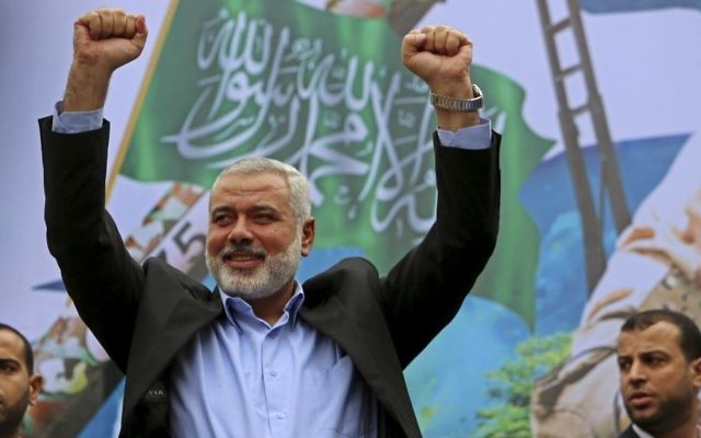 Hamas leader Ismail Haniyeh greets supporters during a rally to commemorate the 27th anniversary of the Hamas militant group in Jebaliya in the northern Gaza Strip, December 12, 2014 . (AP/Adel Hana)