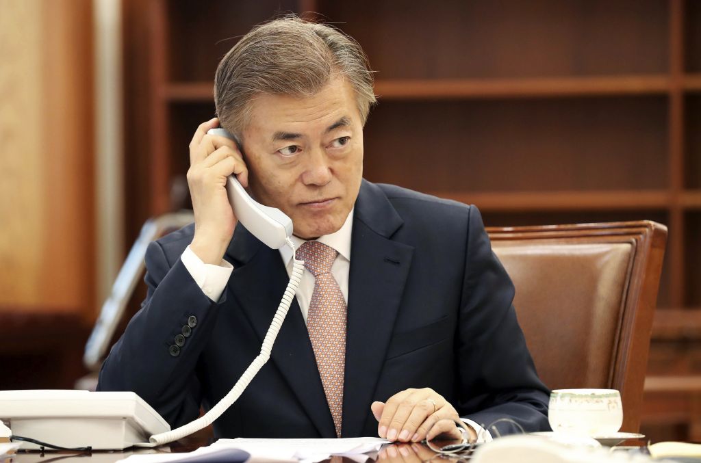 South Korean President Moon Jae-in talks on phone with Japanese Prime Minister Shinzo Abe at the presidential Blue House in Seoul, South Korea, May 11, 2017. (Yonhap via AP)