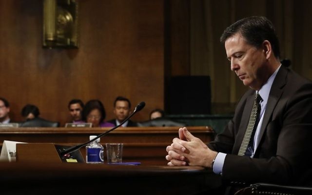In this Wednesday, May 3, 2017, photo then-FBI director James Comey pauses as he testifies on Capitol Hill in Washington, before a Senate Judiciary Committee hearing. (AP/Carolyn Kaster)